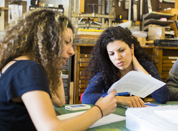 two student discussing a paperwork